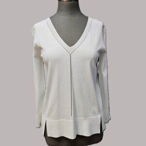 D. Exterior Long Sleeve V-neck Top